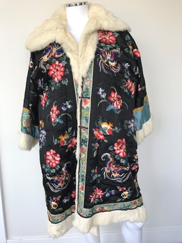 Lot 119 - A Chinese black silk, fur lined and trimmed winter coat, circa 1925