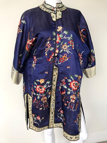 Lot 120 - A Chinese navy blue silk and embroidered summer coat, circa 1925
