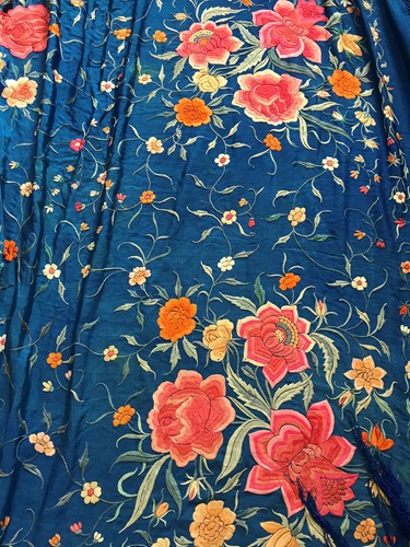 Lot 121 - A Chinese blue silken and embroidered shawl, circa 1925