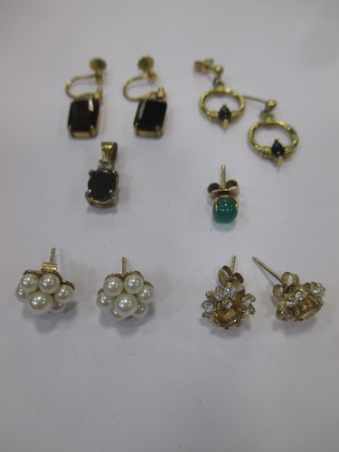 Lot 135 - A collection of four pairs of earrings...