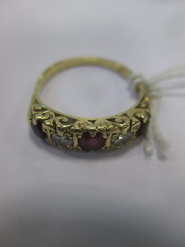 Lot 186A - A ruby and diamond carved head style ring...