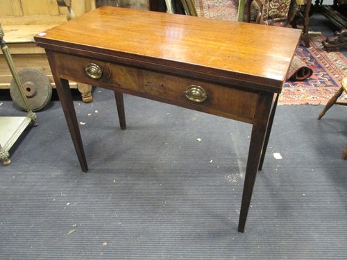Lot 476 - A 19th century mahogany folding tea table with...