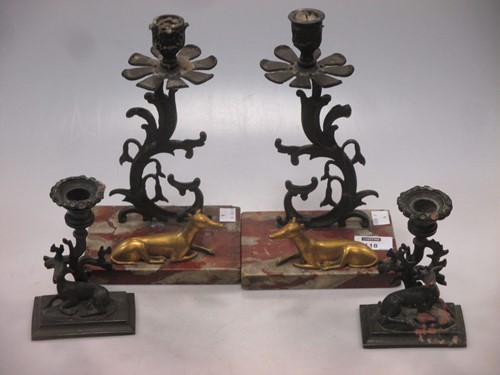 Lot 118 - A pair of bronze candle sticks with deer,...