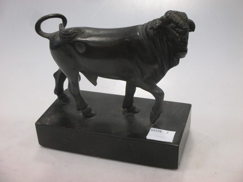 Lot 117 - A bronze bull, 11cm high (not including base)