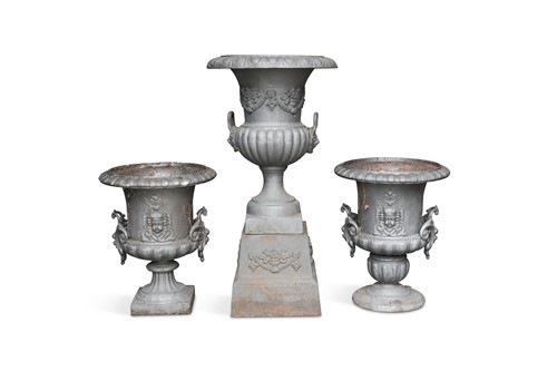 Lot 643 - Three large cast iron Campagna style urns with handles of similar design
