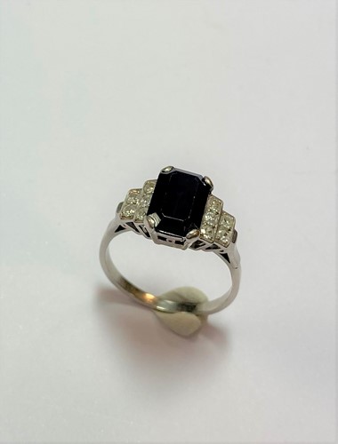 Lot 74 - An Art Deco style sapphire and diamond ring