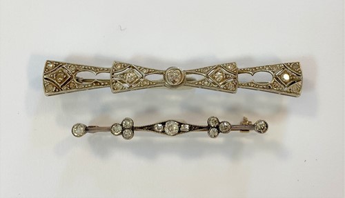 Lot 38 - Two diamond set bar brooches