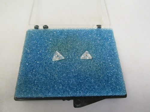 Lot 151 - Two loose triangular shaped diamonds, the...