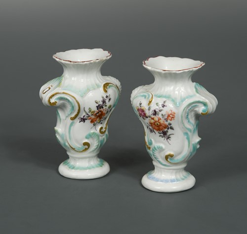 Lot 15 - A pair of 18th century Derby patch mark miniature rococo vases