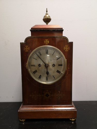 Lot 30 - A mahogany and brass inlaid mantel clock circa 1900