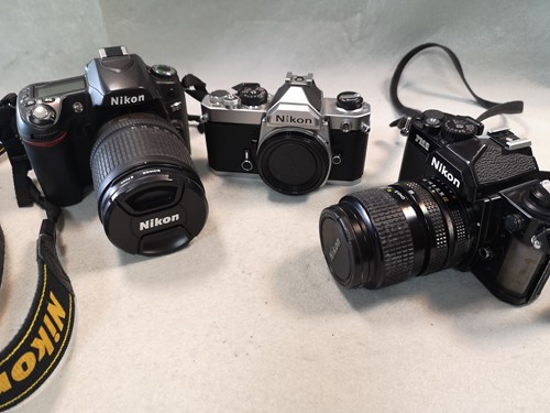 Lot 24 - A collection of Nikon 35mm cameras and lenses