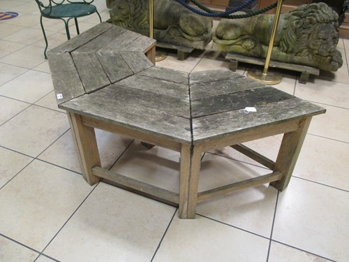 Lot 565 - A semicircular convex garden bench to fit...