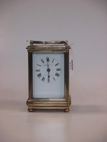 Lot 111 - A small French brass carriage timepiece