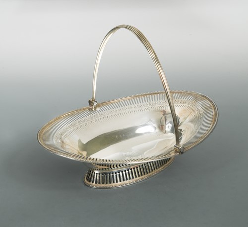 Lot 484 - A George III 18th Century silver swing handled bread basket