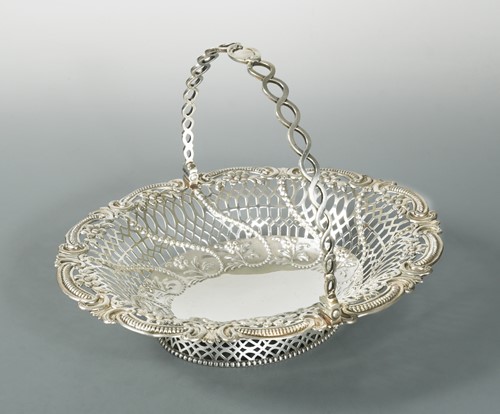 Lot 565 - A Victorian silver swing handled bread basket