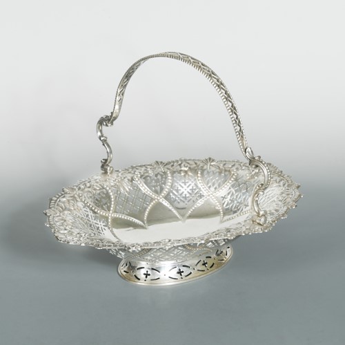 Lot 567 - A Victorian silver swing handled cake basket
