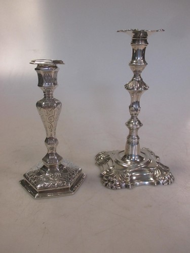 Lot 240 - A George III cast silver taperstick together...
