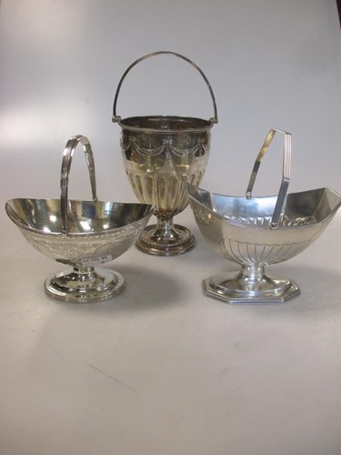 Lot 247 - Three Victorian silver swing handled sugar...