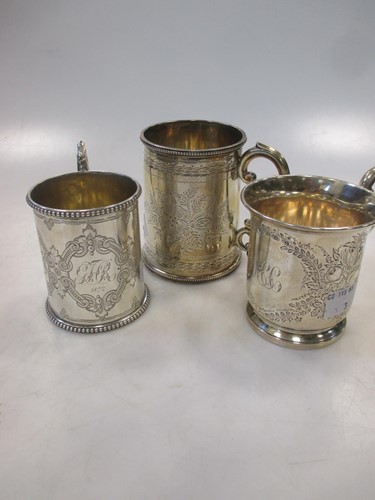 Lot 200 - Three Victorian silver christening tankards,...