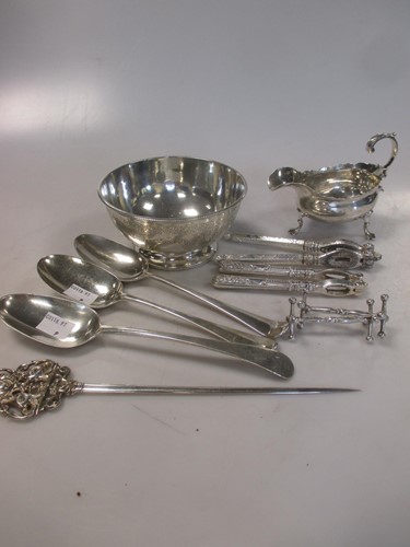 Lot 230 - A collection of silverware to include a bowl,...