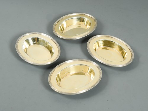Lot 513 - A set of four George III silver bon bon dishes