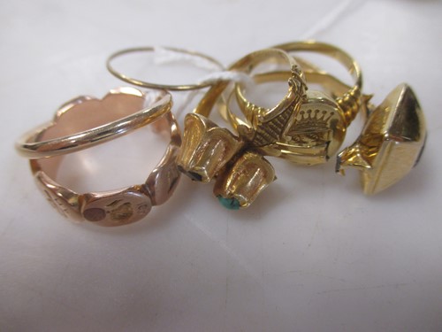 Lot 166 - Three dress rings and a wedding ring testing...