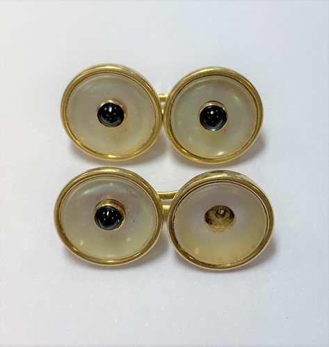 Lot 79 - A pair of mother of pearl and sapphire cufflinks