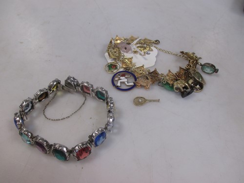 Lot 170 - A filigree charm bracelet testing to at least...