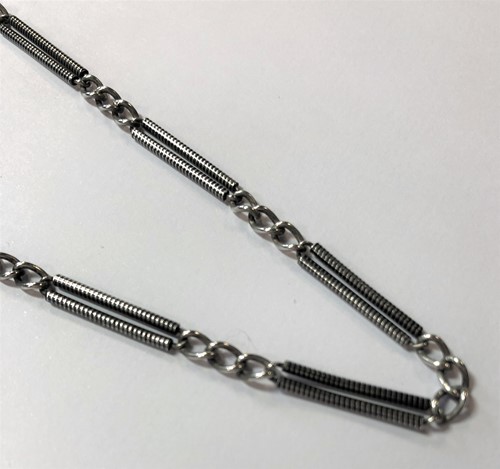 Lot 254 - A white metal and black enamel 'Albertina' chain