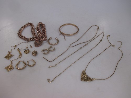 Lot 156 - Two 'charm' style bracelets marked '9ct'...