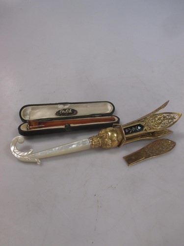 Lot 157 - A mother of pearl set posy holder together...
