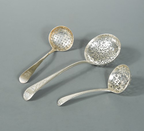 Lot 503 - Three 18th Century George III sifting spoons by Thomas Chawner