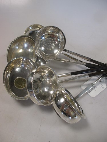 Lot 246 - A collection of six silver punch ladles, four...