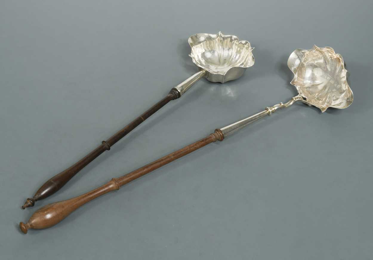 Lot 436 - Two George II silver punch ladles