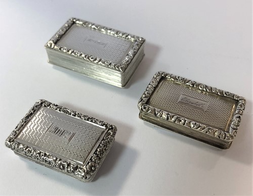 Lot 371 - A trio of 19th Century silver miniature vinaigrettes