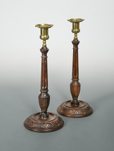 Lot 40 - A pair of turned and carved columnar candlesticks