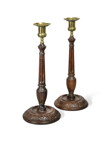 Lot 399 - A pair of turned and carved columnar candlesticks