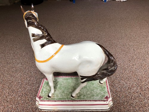 Lot 70 - A fine and rare Leeds pottery horse, circa 1825