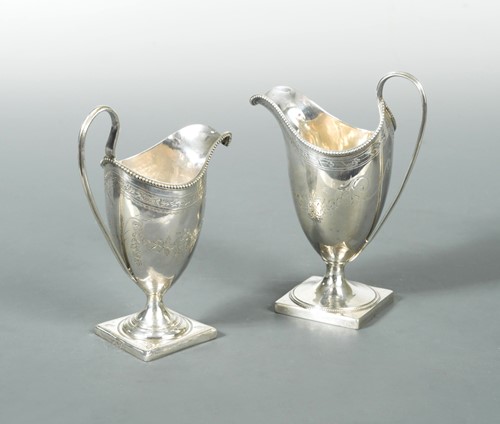 Lot 517 - Two George III silver helmet cream jugs by Peter & Ann Bateman