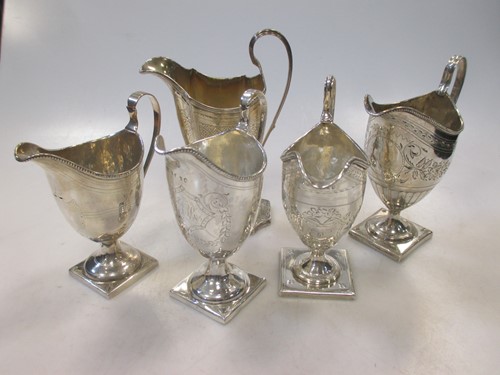 Lot 207 - A collection of 5 Georgian silver helmet style...