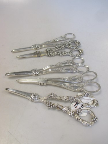 Lot 216 - Five pairs of Victorian silver grape scissors...