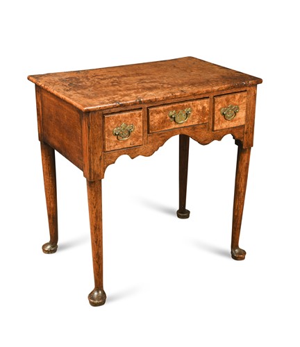 Lot 894 - A George II burr maple and oak lowboy