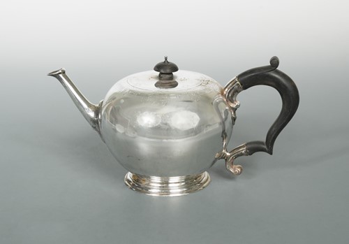 Lot 603 - A George V silver bullet style teapot