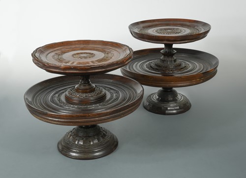 Lot 30 - A matched pair of engine turned lignum vitae two-tier tazze, late 17th century