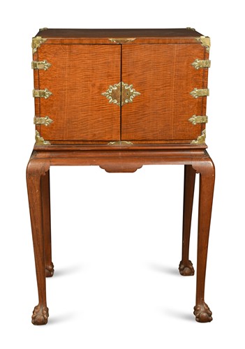 Lot 135 - A brass mounted fiddleback mahogany chest on stand, late 19th century