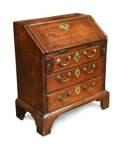 Lot 21 - A small scale early George III fall fronted mahogany bureau