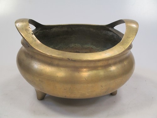 Lot 20 - A Chinese bronze two handled censor with seal...