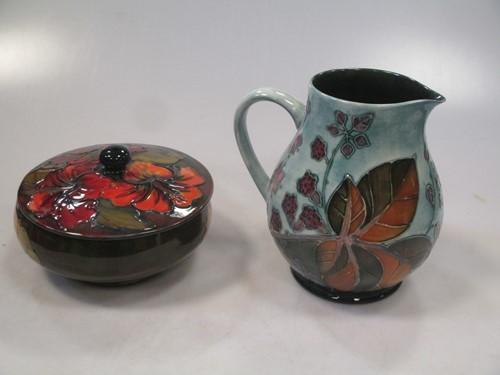 Lot 4 - A Moorcroft flambé Hibiscus pattern drinking...