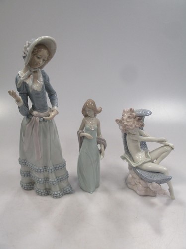 Lot 16 - Three Lladro figures to include two figures of...