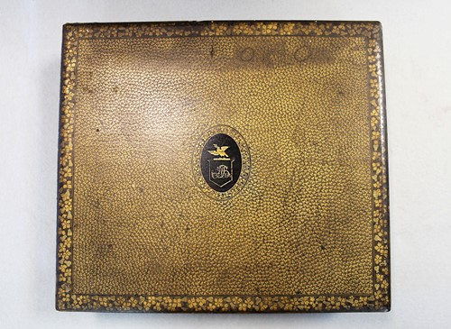 Lot 17 - A Chinese export black and gold lacquer games box, 19th century
